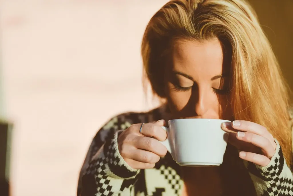 young woman drinking matcha